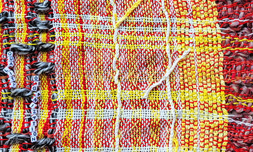 A closet of handmade clothes and a skeleton