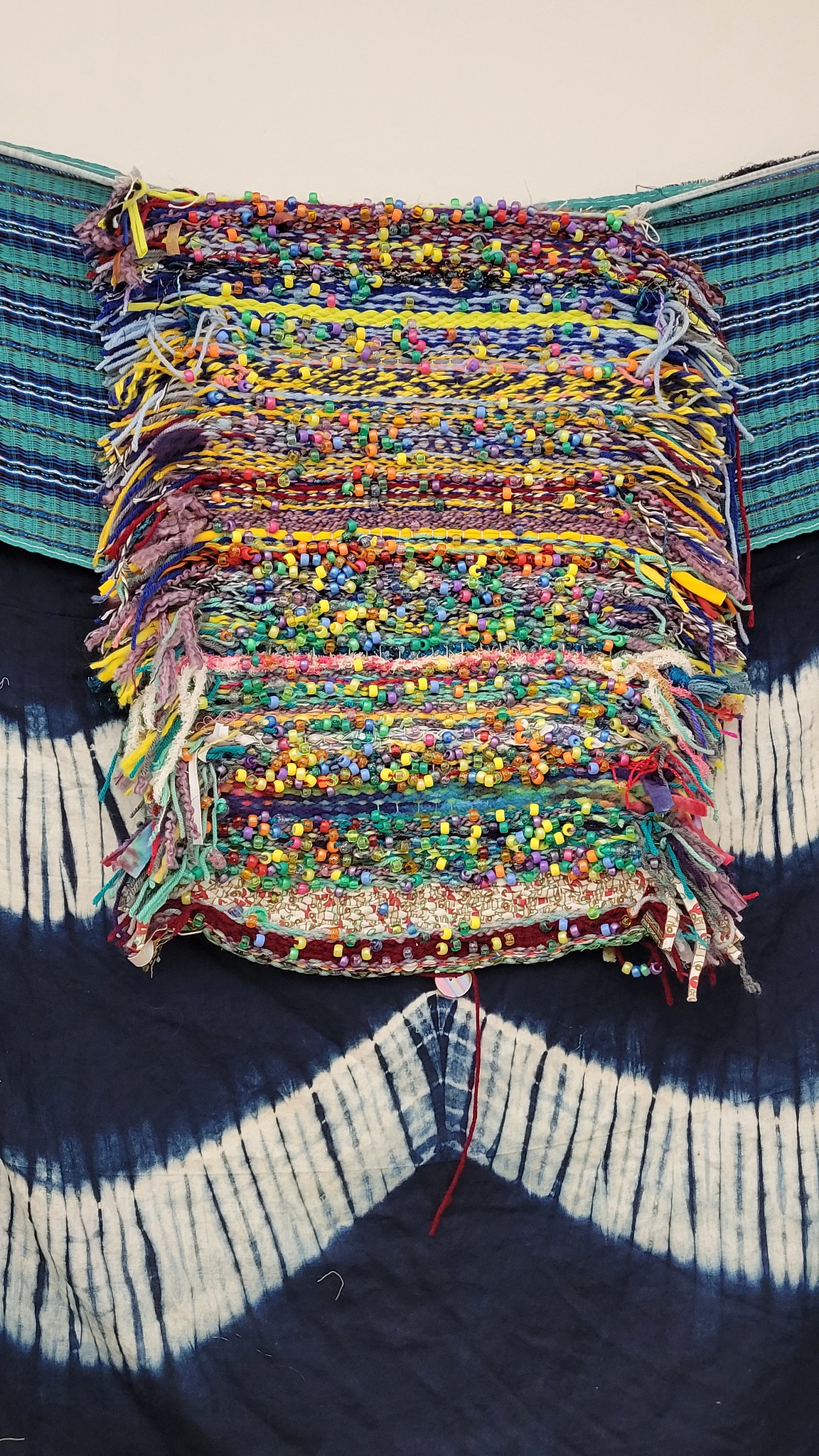 Guestbook loom from a past year on the wall